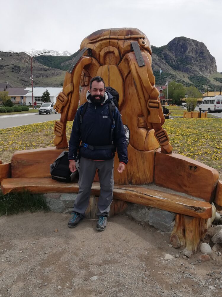 Man with wood statue